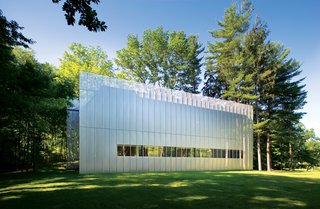 The Salt Point House (2007) is a two-bedroom cedar box cloaked in a perforated and corrugated stainless-steel screen. It’s set on a wooded, nine-acre parcel in New York’s Hudson Valley.