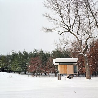 In the winter, instead of floating over the pond, the hut sits lightly above the snow. "It's protected and serene but alive with subtle energy," Poss says. Photo by Phillip Kalantzis-Cope.Don't miss a word of Dwell! Download our FREE app from iTunes, friend us on Facebook, or follow us on Twitter!
