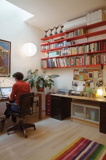 The forced air unit's slim design lets it disappear on the office's top shelf.