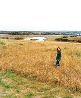 Staten Island - Photo 3 of 3 - The tall vegetation surrounding Carrie Grassi, Freshkills Park land-use and outreach manager, grows atop what was formerly the world’s largest landfill: 150 million tons of (mostly) garbage, accumulated over more than half a century.