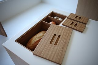 Viola Park's New Kitchen Islands - Photo 3 of 5 - Make that bread box and bread bin. These In-Counter Storage Modules also help keep the prep area clear.