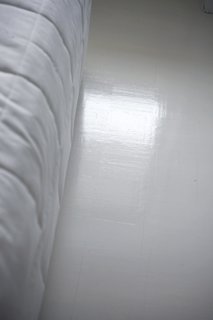 It took Susanna several layers of sanding—and then finally tossing her water-based paint and selecting the proper oil-based formula—to get the floor as white as she'd envisioned. But she couldn't be happier with the result. "The apartment looks bigger when there are white surfaces for the light to bounce on," she says.