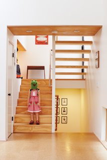 Just inside, Pippa, one half of the ever-entertaining twins, goofs around on the stairs leading from the entrance to the main floor and the bedrooms below.