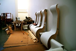 Adding function to the form, the columns are fitted with exaggerated shapes to allow for seating of various sizes. Such large rooms tend to become a thoroughfare, Rozen explains, so adding functionality to draw visitors not only to occupy but also examine the room was an important goal.