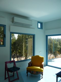 Everything About This Vacation Home in Israel is a Little Crazy - Photo 8 of 8 - The public space, both inside and out, ripples in blue around the three blocks.<br><br>Photo courtesy <br><br>Z-A Studio.