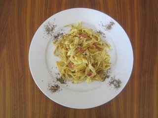 Anne's homemade pasta carbonara, plated with her requisite generous serving of black pepper.