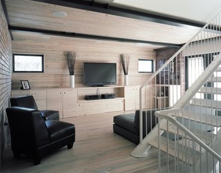 Moore has been using the so-called beetle-kill pine in his projects for years. In the Damianos’ house, he lined the floors, ceiling, cabinetry, and walls of the second-story living area, white-washing the planks "to let a little more sunlight bounce around the room."