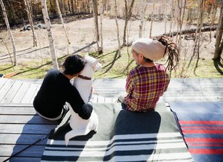 Scenes from a weekend in the woods feature many .......Research products, including camping cookware and striped wool blankets.