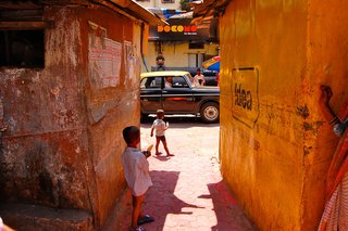 Perhaps my favorite shot. After being invited into a walkway to dance with a large family in their backyard, I turned, and spotted children with popsicles in hand, and a Taxi, all perfectly framed.
