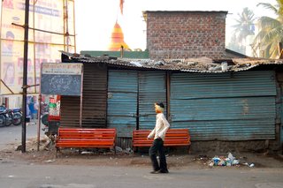 I loved sitting and watching people. In New York City (where I live) I am part of the movement; in India I removed myself from the hustle. From afar, I watched people coming and going, set against colorful backdrops.