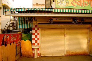 During the day, storefronts are packed with people. I coveted my time alone in the streets in the morning hours before the hustle and bustle started. These same storefronts, when closed, had a dramatically different energy.
