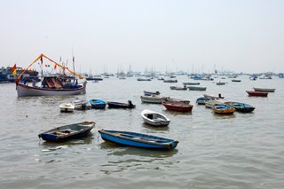 In Mumbai's harbor, boats speckle the water. They looked to be so close to one another that I imagined being able to jump from one to the next like lilly pads.