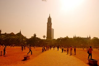 Hundreds of men played cricket below the University of Mumbai's Rajabai Clock Tower, which was modeled after Big Ben.
