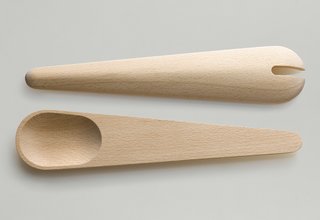 Hang Around and Toss Around - Photo 3 of 5 - The Toss Around spoons differ from the Hang Around set as they are both spoons (rather than one spoon and one spatula), lack the slat in the back, and feature shallower spoons with a notch in one.