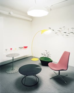 The studio’s front room is a makeshift showroom, open to the public three days a week. Among the wares on view are Förster’s yellow Cirle lamp, made of bent sheet metal with a matte rubber finish; a mauve Spoon chair, inspired by the shape of Japanese spoons; the Umbrella pendant lamp; Mix bowls and vases, made of crystal and plastic; and three low pieces (from left to right), the Cake table, the Breeze coffee table, and the asymmetrical Drop stool.