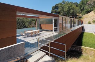 Marin Home Tours 2011 - Photo 2 of 3 - Stanley Saitowitz's Bridge House was built atop a challenging parcel. The rectangular structure spans a small valley created by a creek.