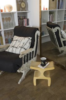 Green Living in Barcelona - Photo 9 of 14 - Scholtus created what she calls the "Never-Empty Shelf" of boards made from recycled sawdust from FSC-certified wood. The natural Portuguese cork floor tiles from Wicander were installed without glue.