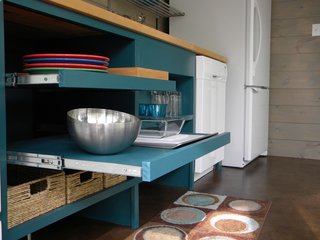 The open, pull-out shelves allow for easy reaching and the gap at the bottom of the drawers makes room for the feet of someone in a wheelchair so they can be closer to the counter.