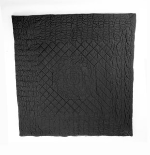The Wong Show - Photo 6 of 7 - Wong's works grappled with perceptions of safety and security in post-9/11 America. This quilt is made from ballistic nylon, a material typically used in military applications as a protective shield from flying debris. Here, Wong uses the material in a quilt (a comforting object) with a rather traditional pattern, commenting on a need for a different sense of comfort and security.<br><br>Tobias Wong, <br><br>Bulletproof Quilted Duvet, 2004, ballistic nylon, cotton, and cotton flannel; Collection SFMOMA, gift of Josee Lepage; © Estate of Tobias Wong; photo: courtesy SFMOMA.