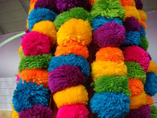 Color Me Mad! - Photo 15 of 31 - Colorful pompoms in all the vibrant colors found throughout the fair.
