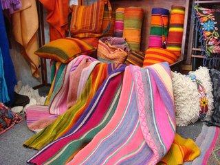 Traveling With Michelle - Photo 4 of 5 - A trove of yet more vibrantly colored rugs, pillows, and blankets.