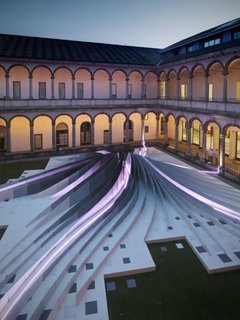 Zaha Hadid's Milan Installation - Photo 3 of 5 - A nighttime view, all lit up with Artemide fluorescent tubes.