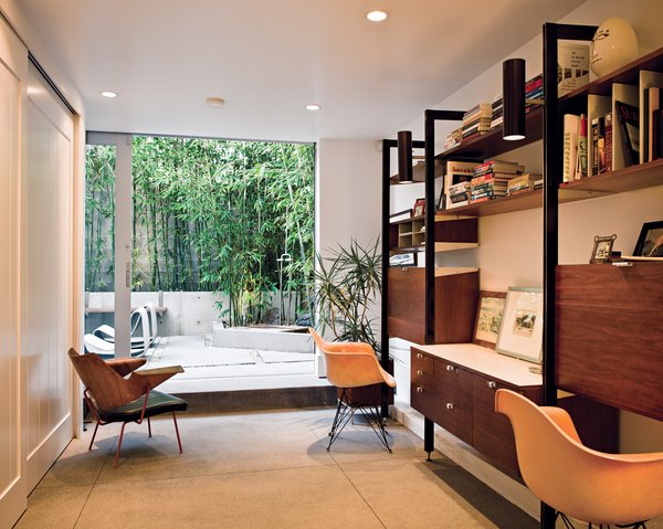A bentwood Robin Day chair keeps the Herman Miller classics company. Through the office’s door, nestled in the bamboo grove, is an outdoor shower, fashioned after those found in San Onofre, farther south.