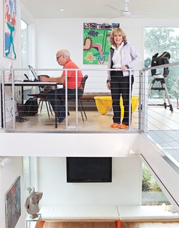 Church and Jett use the front loft for both work and play, thanks to a vintage mid-century desk that converts to a game table.