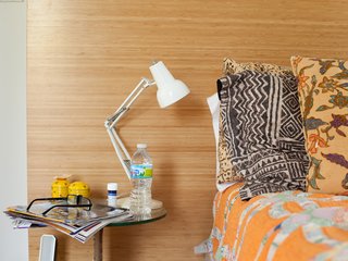 Church and Jett's bed is splashed with eclectic textiles and linens.
