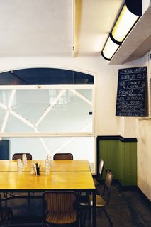 Journal Canteen is decidedly more humble, though its rough interior and simple objects bespeak a charming sophistication.