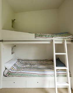 Bach to the Beach - Photo 20 of 30 - In the boys' room, a rolling ladder provides access to the top bunk.