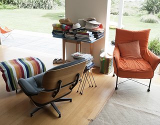 Bach to the Beach - Photo 23 of 30 - There are plenty of places to sprawl in the living room, including an Eames lounger and a custom-made orange chair.