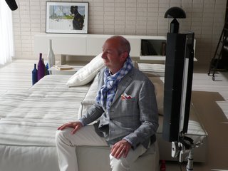 10 Minutes With Piero Lissoni - Photo 1 of 7 - Lissoni is interviewed on his Extrasoft modular sofa in white, defined by its geometric configuration and irregular contours.
