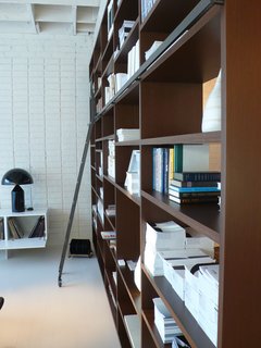 10 Minutes With Piero Lissoni - Photo 7 of 7 - The showroom’s System NXT is outfitted with a library ladder and a multitude of design books.