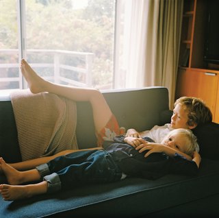 Ten-year-old Henry cuddles with three-year-old Grace.