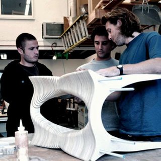 The trio inspects a table in their Laguna Beach, California, workshop.