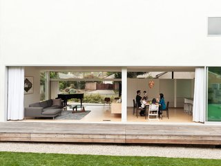 The engawa deck is a traditional Japanese feature. It's a place where guests are often greeted to sit with a casual cup of tea. The David and Mayuko also uses it as a viewing porch toward the back yard for when the kids play in the grass.