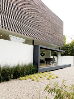 The hardscaping helps keep water use to a minimum. The Lais used gravel—accented by drought-tolerant bamboo—to create their side yard.