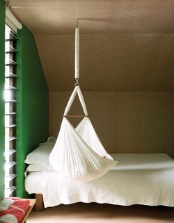 For now, one-year-old Awa is small enough to sleep in the hammock that hangs from the ceiling.