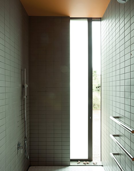 Make Your Parents Happy by Building Them a House - Photo 13 of 25 - The shower provides a glimpse of the outdoors.