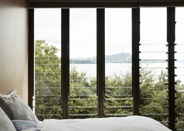 Make Your Parents Happy by Building Them a House - Photo 15 of 25 - Living so near the water the views, especially through these louvered windows, out to Maramaratotara Bay are spectacular.
