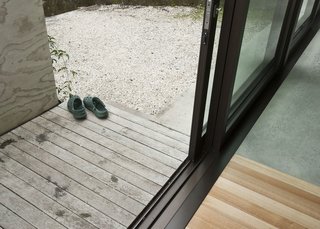 The planks inside the house blend into those on the small porch just outside. It's a nice touch that helps marry the outdoors with the home's interior.