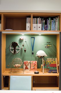 John built a shelf system for the basement when it was Anne’s office; he adapted it to store the kids’ toys when the area became a playroom.
