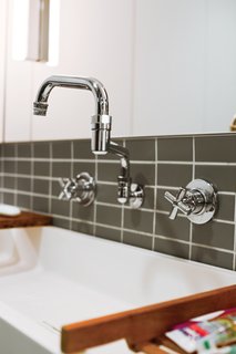 Double Jointed <br><br>In the downstairs bathroom, John chose a "potwasher" fixture by Encore that’s often used in restaurant kitchens. Its double-jointed arm lets it reach every corner of the custom Corian sink, where all five family members wash up—sometimes at the same time.<br><br>componenthardware.com