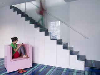 The ground floor is a music room with a kind of blue vibe, thanks to the Richard Woods flooring.