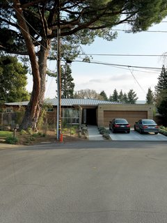 Family Matters - Photo 2 of 16 - From the street, the house maintains a low profile, saving the architectural surprises for the inside.