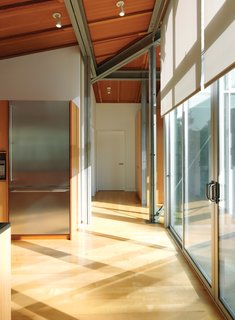 Family Matters - Photo 5 of 16 - The architecture mixes Douglas fir beams and exposed steel framing, achieving its soaring spaces without pretentiousness.