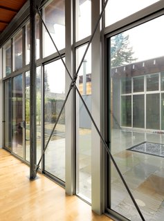 Family Matters - Photo 10 of 16 - Tension rods provide bracing for the glass walls, and exposed bolts reveal how everything is put together.