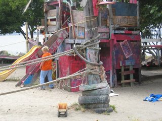 Playgrounds Worth A Trip - Photo 4 of 8 - The standard kit of Adventure playgrounds is an assembly of recycled scraps—tires, boards, paint—which the children are allowed to manipulate as they wish, using simple tools. There is usually sand, water, and mud play, and some adventure playgrounds also incorporate small animal husbandry and cooking over an open fire or in an outdoor oven. Adventure Playgrounds also employ adult playworkers dedicated to ensuring the safety of the children without getting in the way, and studies show that accident rates at Adventure Playgrounds are actually lower than those at conventional playgrounds. Fastidious Parent Alert: expect your kids to get dirty here!<br><br>Photo by Susan Solomon