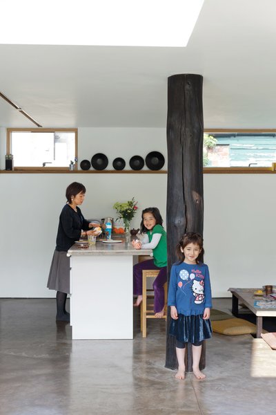 Kiku leans on the "dai koku bashira" as Mika looks on from a barstool from department store John Lewis.